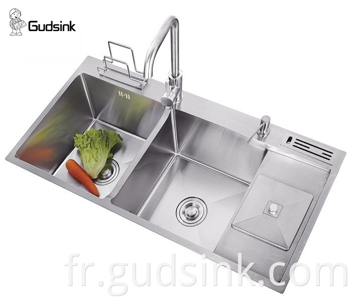 stainless steel sink with gold faucet